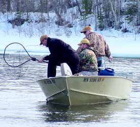 Rainy River Fishing Anglers Netting Walleye