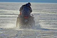 image of ATV on wet late season ice