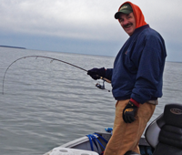 image of Rick Hastings reeling in fish