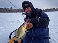 image of Jeff Samsel catching fish on ice