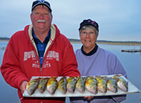 image of Fritz and Penner Becker with platter of Jumb Perch