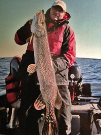 image of Wayne Crandall holding Giant Red Lake Pike