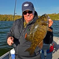 image of Dick Williams with Smallmouth Bass