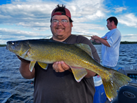 image of Steve Gotchie holding fat Pokegama Lake Walleye