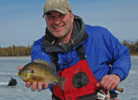 image of Robby Ott with Bluegill on ice
