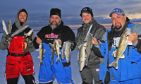 image of red lake ice fishermen with lots of Walleyes
