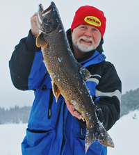 image of Greg Clusiau holding big Lake Trout
