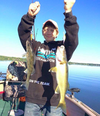 image of young man witrh walleye caught using lead core line