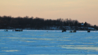 image of trucks on the ice at Leech Lake