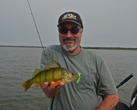 image of fisherman with big Perch