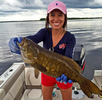 image of woman with huge Smallmouth Bass