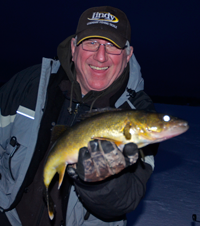 image of Arne Danielson holding big Walleye