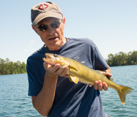 image of Scott Hall with eating size Walleye