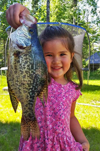image of little girl with big crappie
