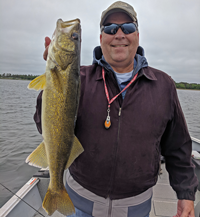 image of paul kautza with big walleye