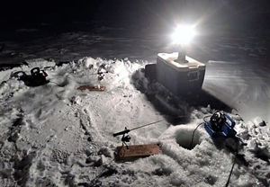 image of icer fishing gear lit by lantern