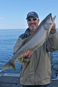 image of lorin lemire with lake trout