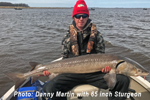 image of Danny Martin with 65 inch sturgeon