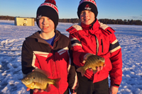 image of boys with big blugills on ice
