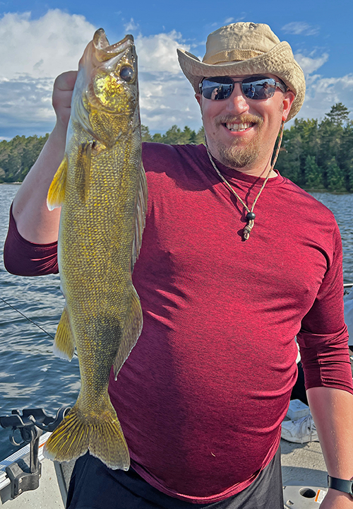 image of Josh Hoffert with big walleye caught on a wiggle worm