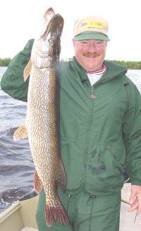 image of Larry Lashley holding big northern pike