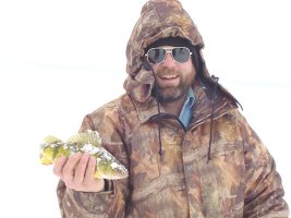 Tim Schultz, owner of the 
    Bowstring Store shows off a nice Lake Winnie Winter Jumbo Perch