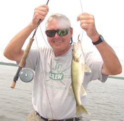 image of carl begquist with walleye caught on flyrod