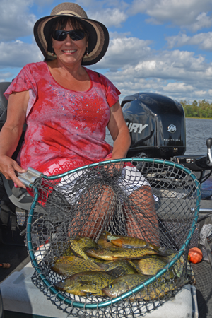 image of the hippie chick with net full of crappies