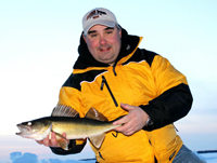 image of Tom Batuik holding Walleye