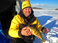 Jon Thelen showing Perch caught while ice fishing