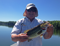 image of Rich Prykop with hefty Largemouth Bass