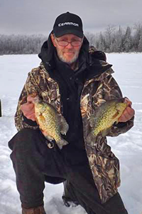image of Bill Donelly holding Crappies on the ice