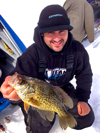 image of Blake Liend holding Crappie on the ice