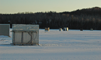 image of ice fishing shelters on Pokegama