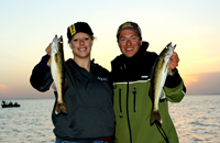 image of Nik Dimich and Becca Kent holding Walleyes