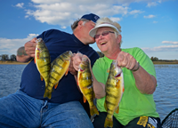 image of Karen and Kyle Reynolds with Leech Lake Perch