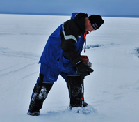 image of augering ice hole on Bowstring Lake 