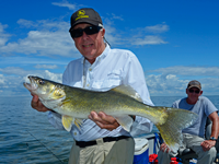 image of Bill Linder holding nice red lake walleye