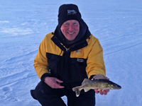 image of fishing guide Jeff Sundin holding Walleye on Winnibigoshish