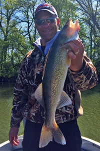 image of Duane Rothstein with a nice Walleye