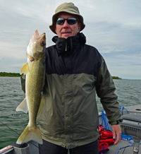 image of Bob Baird holding Walleye on Leech Lake