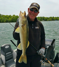 image of Jeff Sundin holding big Walleye