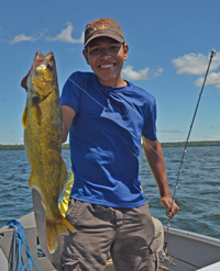 image of Miguel holding big Walleye