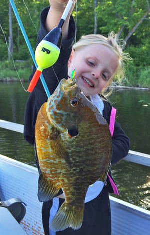 image of Ava holding big sunfish