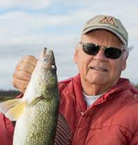 image of bob carslon holding big walleye