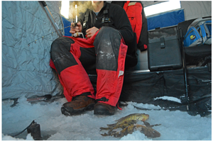 image of ice fisherman with fish