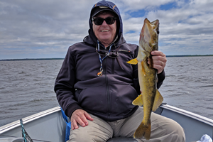 image of dick williams with winnie walleye
