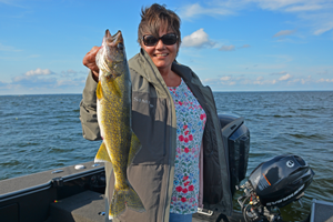 image of the hippie chick with Mille Lacs walleye