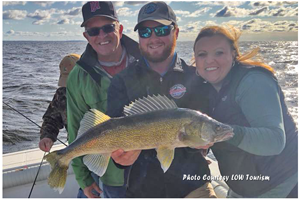 image of guide and crew with big walleye