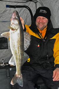 image of Jon Thelen with Lake Mille Lacs walleye